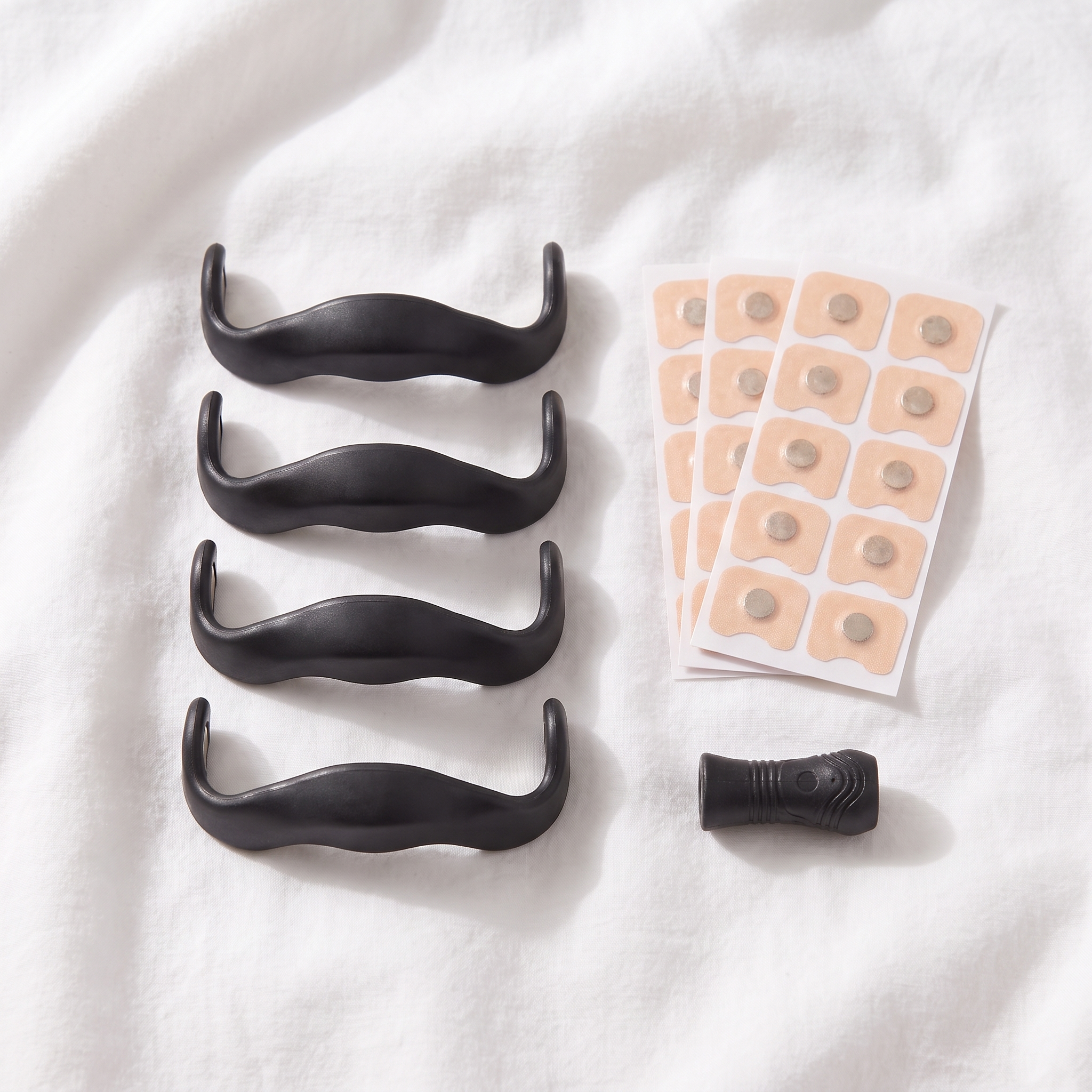 Four Voria BreezeFlow bridges with adhesive tabs and sizing tool